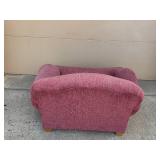 Cozy Plum-Colored Armchair with Decorative Pillow