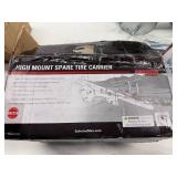 HIGH MOUNT SPARE TIRE CARRIER.