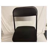 2 Black Plastic Folding Chairs