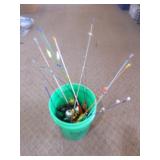 Bucket of Ice Fishing Poles and Reels