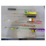 Bucket of Ice Fishing Poles and Reels