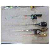 Bucket of Ice Fishing Poles and Reels