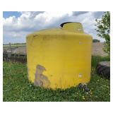 1500 Gallon Yellow Poly Tank, holds water, has some fluff on bottom