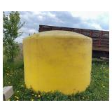 1500 Gallon Yellow Poly Tank, holds water, has some fluff on bottom