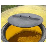 1500 Gallon Yellow Poly Tank, holds water, has some fluff on bottom