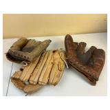 Three Leather Baseball Gloves