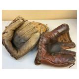 Three Leather Baseball Gloves