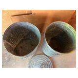 Two Galvanized Metal Trash Cans with Lids