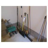 Lot of shovels, brooms, mop and a y...