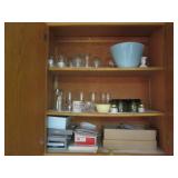 Cupboard full of Hamms Coca Cola an...