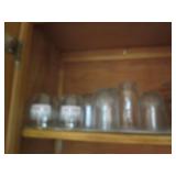 Cupboard full of Hamms Coca Cola an...