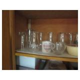 Cupboard full of Hamms Coca Cola an...