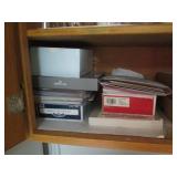 Cupboard full of Hamms Coca Cola an...