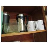 Cupboard of cups, mugs, Pyrex, and ...