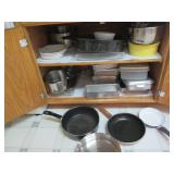 Cupboard of baking pans and kitchen...