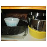 Cupboard of baking pans and kitchen...