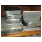 Cupboard of baking pans and kitchen...