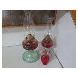 2 Oil lamps and a bottle of lamp oi...