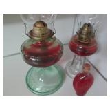 2 Oil lamps and a bottle of lamp oi...