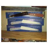 Wood box filled with new knives and...