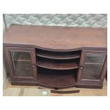Wooden Entertainment Console with Glass Paneled Doors