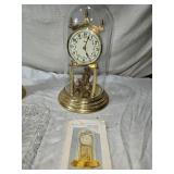 Brass Candlestick, Anniversary Clock, and Crystal Tray