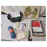 Craft Supplies with Yarn, Patterns, and Cross-Stitch Pillow