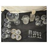 Elegant Crystal Glassware including Wine and Champagne Glasses, Decanter, and Ice Bucket