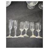 Elegant Crystal Glassware including Wine and Champagne Glasses, Decanter, and Ice Bucket