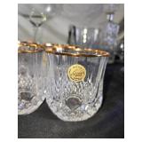 Elegant Crystal Glassware including Wine and Champagne Glasses, Decanter, and Ice Bucket