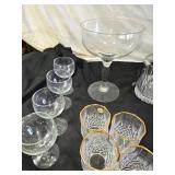 Elegant Crystal Glassware including Wine and Champagne Glasses, Decanter, and Ice Bucket