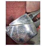 Collection of Vintage Metal Items: Beer Bottle Flashlight, Garlic Press, and Mess Kit Marked 1942