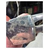 Collection of Vintage Metal Items: Beer Bottle Flashlight, Garlic Press, and Mess Kit Marked 1942