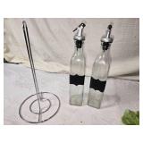 Variety of Kitchenware with Tupperware, Utensils, Veggie Decor, Fruit Decor, and Glass Olive Oil Dispensers