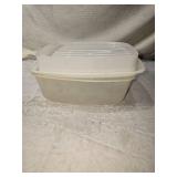 Variety of Kitchenware with Tupperware, Utensils, Veggie Decor, Fruit Decor, and Glass Olive Oil Dispensers