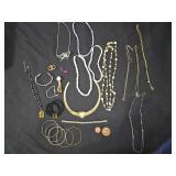 Assorted Jewelry with Necklaces, Bracelets, and Tokens