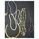 Assorted Jewelry with Necklaces, Bracelets, and Tokens