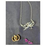 Assorted Jewelry with Necklaces, Bracelets, and Tokens