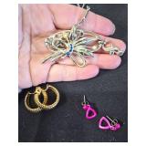 Assorted Jewelry with Necklaces, Bracelets, and Tokens