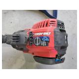 Troy Built gas weed whip and a shovel