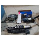 Assorted power tools and a car jack