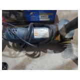 Assorted power tools and a car jack