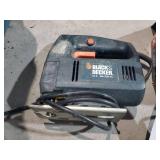 Assorted power tools and a car jack