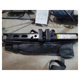 Assorted power tools and a car jack