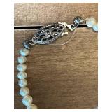 Collection of Assorted Necklaces and Bas-Relief Plaque