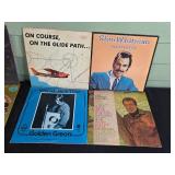 Collection of Classic Vinyl Records Featuring Various Artists