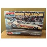 Three New Monogram Snap Tite Model Car Kits including Pepsi Challenger, Blue Max and Budweiser King