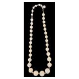 Costume Jewelry including Orange Beaded Necklace and Two Floral Pins