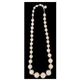 Costume Jewelry including Orange Beaded Necklace and Two Floral Pins