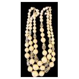 Costume Jewelry including Orange Beaded Necklace and Two Floral Pins